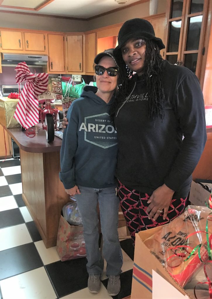 Longtime friends, Sheila Tamble of Tamble Realty in Smithville and Sumai Lokumbe of Sumai's Hair Studio in Bastrop stopped by to deliver some Christmas cheer to a couple of CASA children.