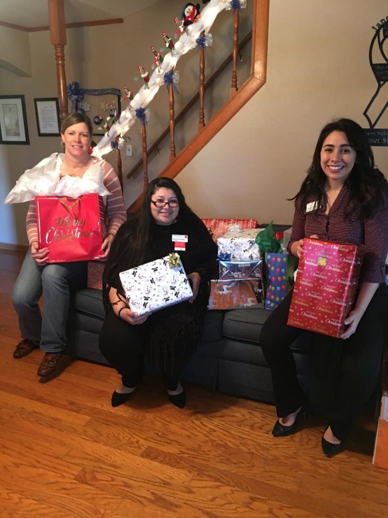 Adriana Caballero and Clarissa Johnson of Wells Fargo Bank in Bastrop also spread some holiday cheer to our CASA kids.
